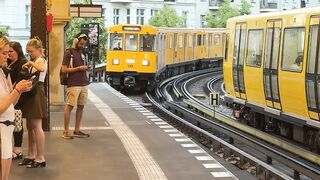 Travel Backpack - vibrant yellow train at berlin station | Trending HD Video