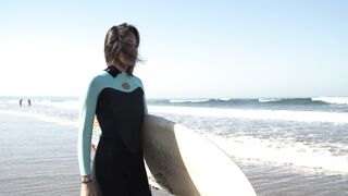 The Shy Snow Woman and the Cursed Ring - a woman carrying her surfboard | Trending HD Video