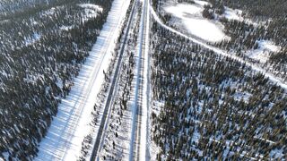 Travelon - descending drone video of a road in a winter landscape | Trending HD Video