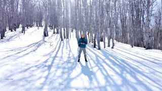 Winter Coat - a man flying a drone at a ski resort in the balkan mountains | Trending HD Video