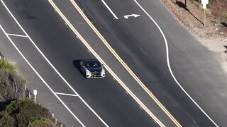 Travelpro - aerial view of cars on curved highway | Trending HD Video