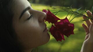 The Bold and the Beautiful - woman enjoying fragrant roses outdoors | Trending HD Video