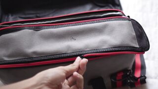 travelite - opening the zipper of a panel bag | Trending HD Video