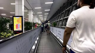 Travelon - vibrant airport walkway during daytime transit | Trending HD Video