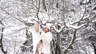 Snow boot - woman removing snow on tree branches | Trending HD Video