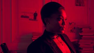 Wonder Woman - a woman looking fiercely at the camera against red background light | Trending H