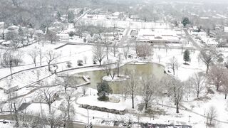 Winter Coat - aerial footage of the park covered with snow | Trending HD Video