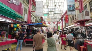The Wedding People A Novel - people walking through an indoor market with many stalls | Trendin