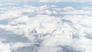 Travelon - view of clouds from an airplane window | Trending HD Video
