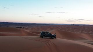 travelite - suv adventure in majestic desert dunes at sunset | Trending HD Video