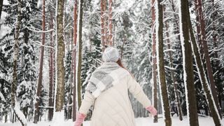 Winter Coat - a woman in a white coat is standing in the snow | Trending HD Video
