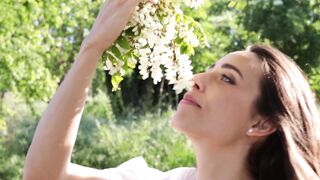Woman Within - woman sniffing the flowers | Trending HD Video