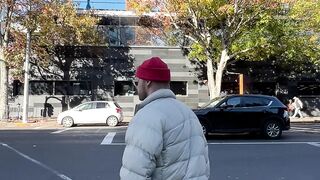 travelite - man crossing busy city street by sky tower | Trending HD Video