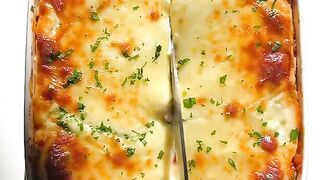 Classic lasagna with homemade meat sauce and creamy bechamel!