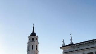 Travelpro - sunny evening square with the cathedral and bell tower | Trending HD Video