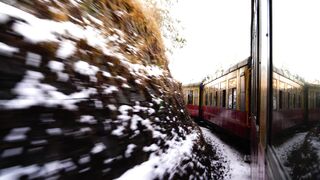 Winter Coat - train traveling on the mountainside in winter | Trending HD Video