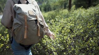 The Shy Snow Woman and the Cursed Ring - a woman hiking while touching wild plants | Trending H
