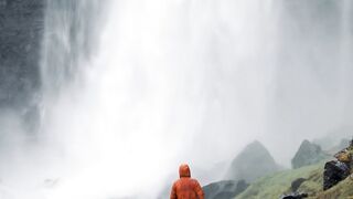 Travelpro - person walking to waterfall | Trending HD Video