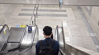 Travel Backpack - people descending escalator in subway station | Trending HD Video