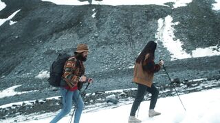 travelite - a couple walking on the field | Trending HD Video