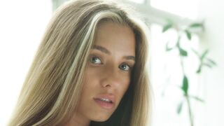 Wonder Woman - an attractive woman brushing her hair | Trending
