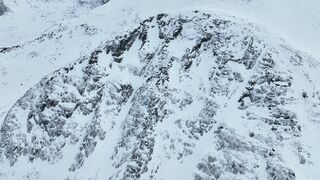 Woman Within - drone footage of snow covered mountains | Trending HD Video