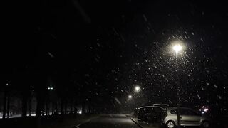 Winter solstice - peaceful night snowfall on city street | Trending HD Video