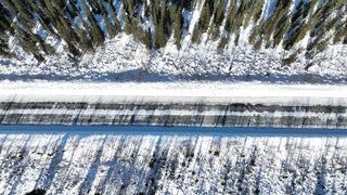 travelite - drone footage of snow covered ground | Trending HD Video