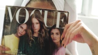 Woman Within - a woman covering her face with a magazine | Trending HD Video