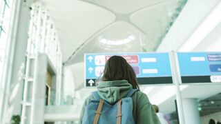 Woman - woman with backpack walking in the airport terminal | Trending HD Video