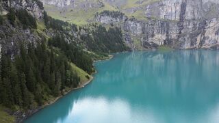 Travelon - aerial view of lake oeschinen in switzerland | Trending HD Video
