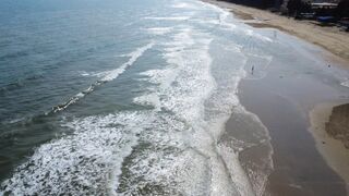 Travelpro - aerial view of serene beach waves crashing | Trending HD Video