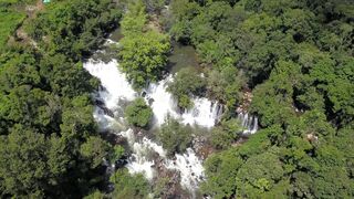 Travel Backpack - a rapid river with waterfalls | Trending HD Video