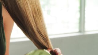 The Pioneer Woman - a woman brushing her long hair | Trending HD Video