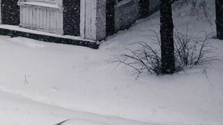 The Shy Snow Woman and the Cursed Ring - a minivan driving on snow covered city street