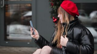 The Pioneer Woman - a woman sitting on the sidewalk in front of a building | Trending HD Video