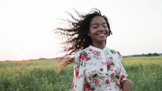 Woman Within - a smiling woman in a flowery dress running in a meadow | Trending HD Video