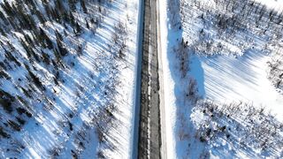 Winter solstice - aerial video of a road in a winter landscape | Trending HD Video