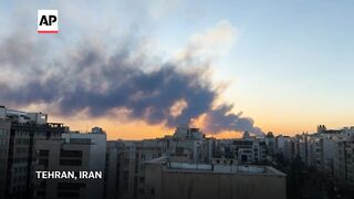 Smoke rises in Tehran after Israel and US strikes target Iran's capital.