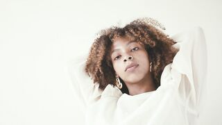 The Pioneer Woman - woman in white long sleeves top holding her hair while looking at camera |