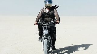 Travelon - motorcycle rider in vast desert landscape | Trending HD Video