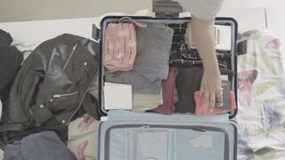 Wonder Woman - a woman packing her things on her luggage | Trending HD Video