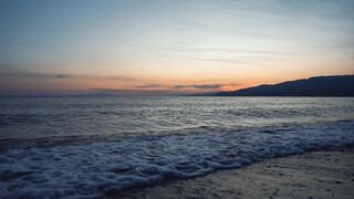 Travelpro - serene summer sunset over ocean waves | Trending HD Video