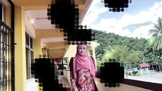 Elegant Woman in Floral Baju Kurung