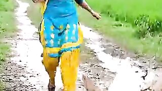 Funny village girl chasing goat