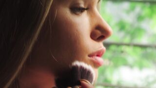 Wonder Woman - close up of a beautiful woman using a makeup brush | Trending HD Video