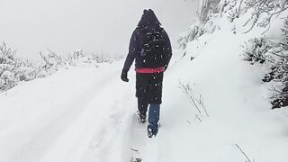 Winter solstice - back view of a couple hiking in the snow | Trending HD Video