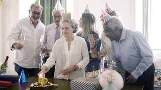 Woman Within - elderly woman lighting her birthday cake | Trending HD Video