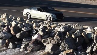 Travelpro - car driving on coastal highway | Trending HD Video