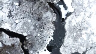 4K resolution - aerial view of ice covered shoreline | Trending HD Video